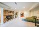 Finished basement featuring a stone fireplace, carpeted flooring, and access to other areas at 835 Timber Lake Trl, Cumming, GA 30041
