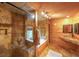 Bathroom featuring stone shower, jacuzzi tub and stone sink at 835 Timber Lake Trl, Cumming, GA 30041
