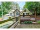 Charming home featuring unique stone accents, with a fenced yard at 835 Timber Lake Trl, Cumming, GA 30041
