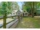 Charming home featuring unique stone accents, with a fenced yard at 835 Timber Lake Trl, Cumming, GA 30041