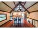 Charming kitchen with a center island, stainless steel appliances, and wooden beams at 835 Timber Lake Trl, Cumming, GA 30041