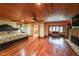 Spacious main bedroom featuring fireplace, hardwood floors, ensuite bathroom, and sitting area at 835 Timber Lake Trl, Cumming, GA 30041