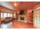 Cozy sitting room features built in shelves, fireplace and hardwood floors at 835 Timber Lake Trl, Cumming, GA 30041