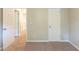 Bedroom with light-colored carpet, doors, and light-colored walls at 3110 Ashly Cove Ln, Snellville, GA 30078