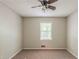 Bedroom featuring neutral walls, carpet, ceiling fan, and a bright window at 3110 Ashly Cove Ln, Snellville, GA 30078