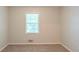 Simple bedroom with neutral carpet, a window with blinds, and light-colored walls at 3110 Ashly Cove Ln, Snellville, GA 30078