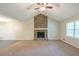 Expansive living room featuring a stone fireplace, vaulted ceilings, and neutral carpeting at 3110 Ashly Cove Ln, Snellville, GA 30078