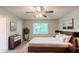Spacious main bedroom featuring a large bed, modern furniture, lots of natural light, and decorative wall art at 3110 Ashly Cove Ln, Snellville, GA 30078