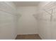 Spacious walk-in closet with built-in shelving providing ample storage space at 3110 Ashly Cove Ln, Snellville, GA 30078