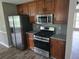 Kitchen with stainless steel appliances, granite countertops, and wood cabinets at 563 Fieldgreen Dr, Jonesboro, GA 30238