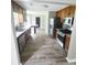 Updated kitchen with stainless steel appliances, wood cabinetry, and granite countertops at 563 Fieldgreen Dr, Jonesboro, GA 30238