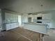 Bright, spacious kitchen with a center island, modern appliances, and ample cabinet space at 1654 Tide Mill Rd, Cumming, GA 30040
