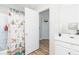 Bathroom with patterned shower curtain and vanity with a shelf at 183 Venture Path, Hiram, GA 30141