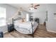 Charming bedroom with wood floors, ceiling fan, and modern decor accents at 183 Venture Path, Hiram, GA 30141