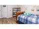 Bedroom with bed, shelf and view of a window with blinds at 183 Venture Path, Hiram, GA 30141
