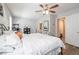 Inviting bedroom with wood floors, ceiling fan, and attached bathroom access at 183 Venture Path, Hiram, GA 30141