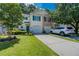 Inviting townhome with manicured lawn, private driveway, and attached garage at 183 Venture Path, Hiram, GA 30141