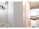 Hallway with view to a living room and stairs with carpet at 183 Venture Path, Hiram, GA 30141