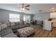 Open-concept living and dining area with stylish furniture and natural light at 183 Venture Path, Hiram, GA 30141