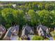 Aerial view of multiple homes surrounded by lush greenery in a quiet residential neighborhood at 4569 Fountain Ne Dr, Marietta, GA 30067