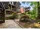 The backyard features layered decks and porches, mature trees, and natural landscaping, blending into the surrounding environment at 4569 Fountain Ne Dr, Marietta, GA 30067