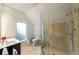 Bright bathroom with a glass enclosed shower, a toilet and a modern vanity with a sleek mirror at 4569 Fountain Ne Dr, Marietta, GA 30067
