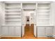 Hallway featuring white built-in shelves and an open doorway at 4569 Fountain Ne Dr, Marietta, GA 30067