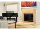 Cozy living room showcases a modern fireplace and a piano at 4569 Fountain Ne Dr, Marietta, GA 30067
