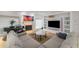 Bright living room featuring a fireplace, piano and a modern entertainment center at 4569 Fountain Ne Dr, Marietta, GA 30067