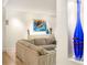 Stylish living room featuring a comfortable sofa, hardwood floors, modern art, and an eye-catching blue vase at 4569 Fountain Ne Dr, Marietta, GA 30067