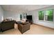 Spacious living room with comfortable seating, neutral tones, large windows, and a relaxing atmosphere at 4569 Fountain Ne Dr, Marietta, GA 30067