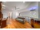 Loft area with hardwood floors, sofa, and ceiling fan at 4569 Fountain Ne Dr, Marietta, GA 30067