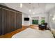 Comfortable main bedroom with hardwood floors, modern closet and ensuite balcony view at 4569 Fountain Ne Dr, Marietta, GA 30067