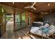 Covered outdoor spa area featuring a hot tub, lounge chairs, and wood paneled walls for a private, relaxing retreat at 4569 Fountain Ne Dr, Marietta, GA 30067