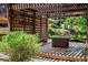 The backyard features a pergola with seating and a lush garden, perfect for outdoor relaxation and entertaining at 4569 Fountain Ne Dr, Marietta, GA 30067