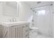 Bright bathroom with a vanity, a soaking tub and tile and a shower with crisp white finishes at 1181 Fairview Ne Rd, Atlanta, GA 30306