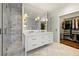 Stunning primary bathroom with a glass-enclosed shower, dual sink vanity, and walk-in closet at 1181 Fairview Ne Rd, Atlanta, GA 30306