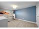 bedroom with a lofted bed, neutral carpet, and star themed blue accent wall at 1181 Fairview Ne Rd, Atlanta, GA 30306