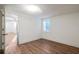 Spacious bedroom with bright walls, hardwood floors, and a view to another room, seamlessly connected at 1181 Fairview Ne Rd, Atlanta, GA 30306