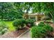 Well-manicured front yard features a walkway leading to the brick home at 1181 Fairview Ne Rd, Atlanta, GA 30306