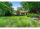 Well-maintained front yard with lush landscaping and a charming brick home nestled amongst mature trees at 1181 Fairview Ne Rd, Atlanta, GA 30306