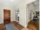 Hallway featuring hardwood floors, white trim, paneled doors, and easy access to other rooms at 1181 Fairview Ne Rd, Atlanta, GA 30306