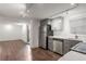 Well-equipped kitchen, showcasing stainless steel appliances and ample cabinet space, flows into living area at 1181 Fairview Ne Rd, Atlanta, GA 30306