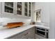 Kitchen detail showcasing the stone countertops, custom cabinets, stainless appliances, and ample countertop space at 1181 Fairview Ne Rd, Atlanta, GA 30306