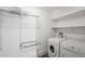 Convenient laundry room featuring a washer, dryer, and built-in storage shelves for organization at 1181 Fairview Ne Rd, Atlanta, GA 30306