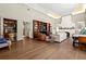Expansive living room boasts hardwood floors, custom shelving, bar area, and fireplace, perfect for entertaining at 1181 Fairview Ne Rd, Atlanta, GA 30306