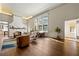 Sun-filled living room featuring hardwood floors, a brick fireplace, and large windows at 1181 Fairview Ne Rd, Atlanta, GA 30306