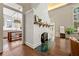 Sunlit living room features a charming white brick fireplace and colorful floor tiling at 1181 Fairview Ne Rd, Atlanta, GA 30306