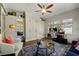 Comfortable living room features a large window, desk, storage and bright decor at 1181 Fairview Ne Rd, Atlanta, GA 30306