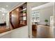 Open living room with built-in storage and view to the living room with fireplace at 1181 Fairview Ne Rd, Atlanta, GA 30306